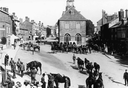 British soldiers performing army manoeuvres in the historic Brackley market place